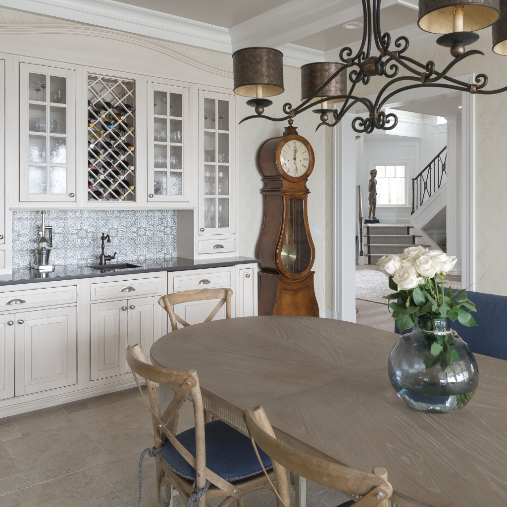 Dining room with a table, chairs, and a grandfather clock.