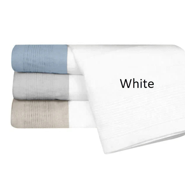 Stack of folded towels in white, gray, and blue on a white background with 'White' text.