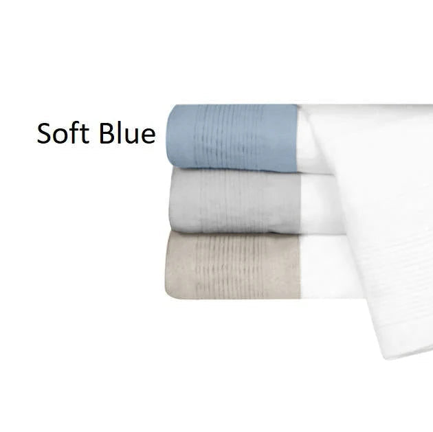 Stack of folded towels in soft blue, gray, and white on a white background