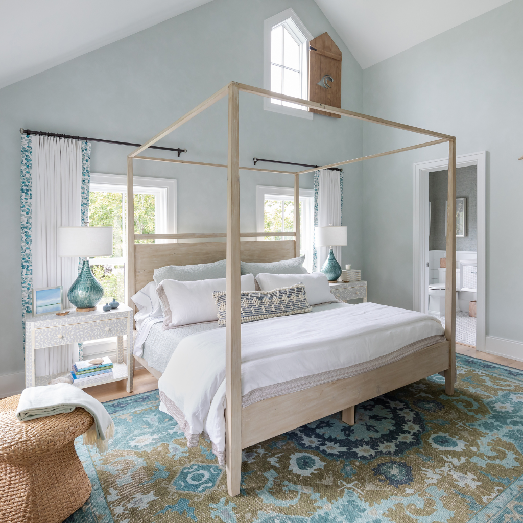 Bedroom with a canopy bed, nightstands, and decorative elements.