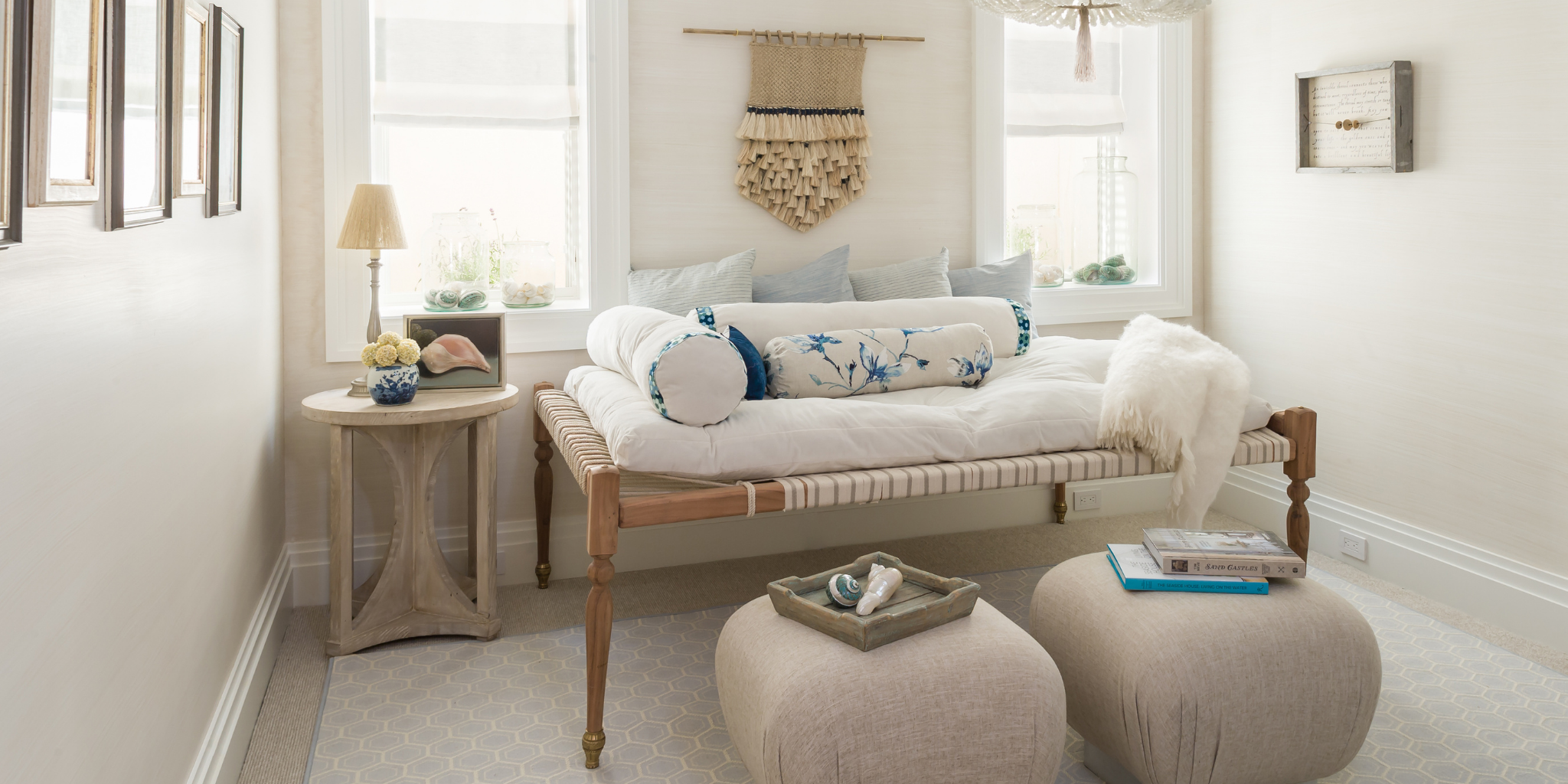Cozy living room with a sofa, ottoman, and side table.