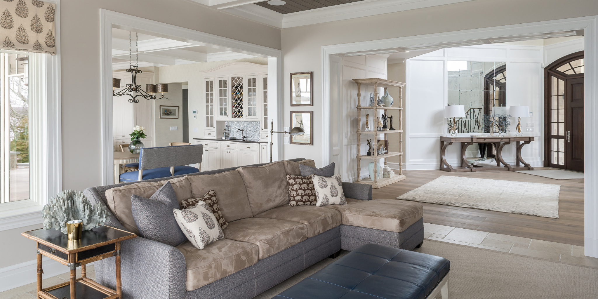 Living room with a sectional sofa, coffee table, and decorative items.